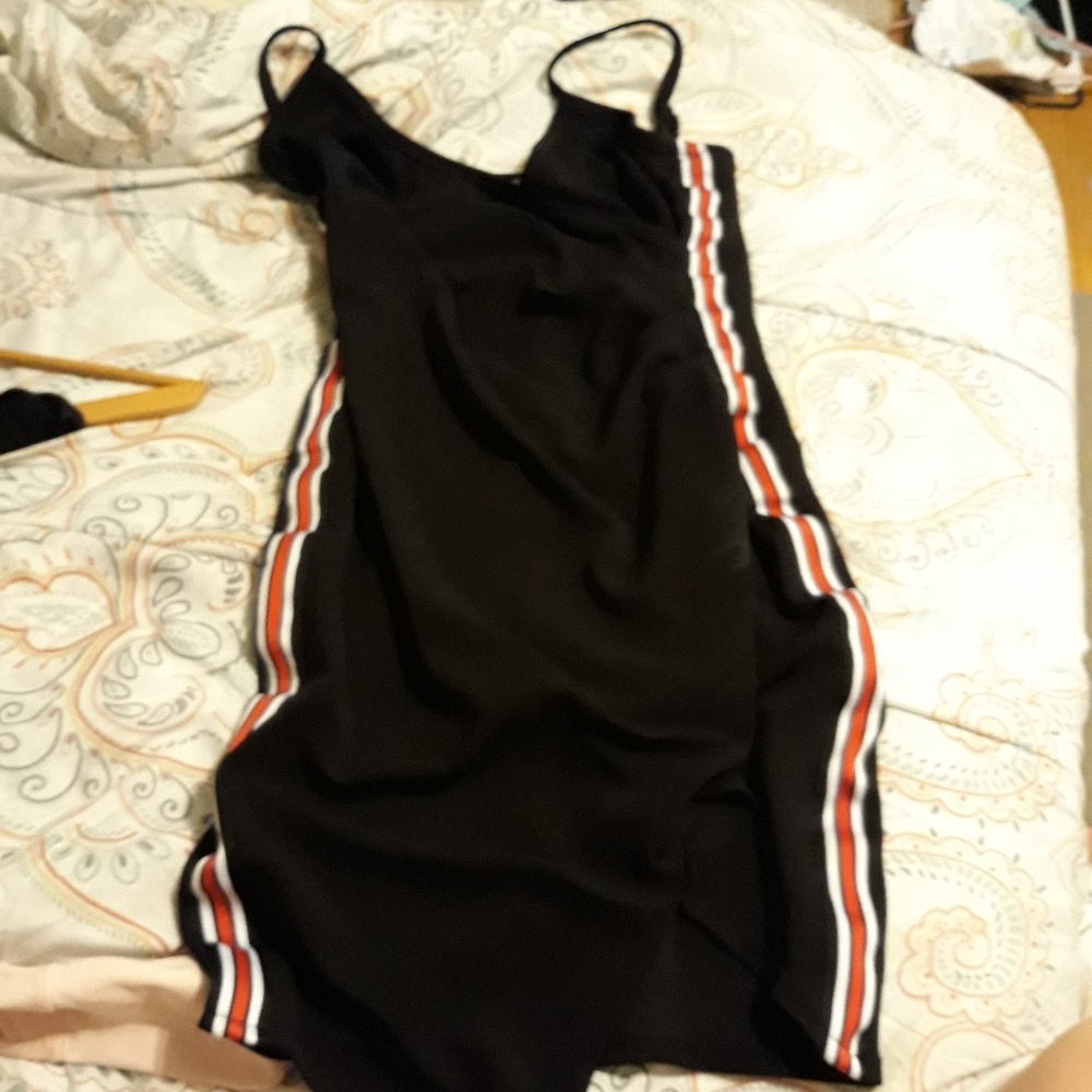 Black dress with red and white strip on the sides